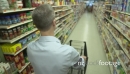 Pushing a shopping cart in a grocery store (4 of 4) 21267