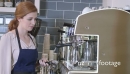 Woman using coffee maker 26917