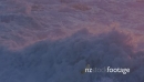 Waves crashing rocky shoreline as sun is setting on piha beach, auckland, New Zealand 26720